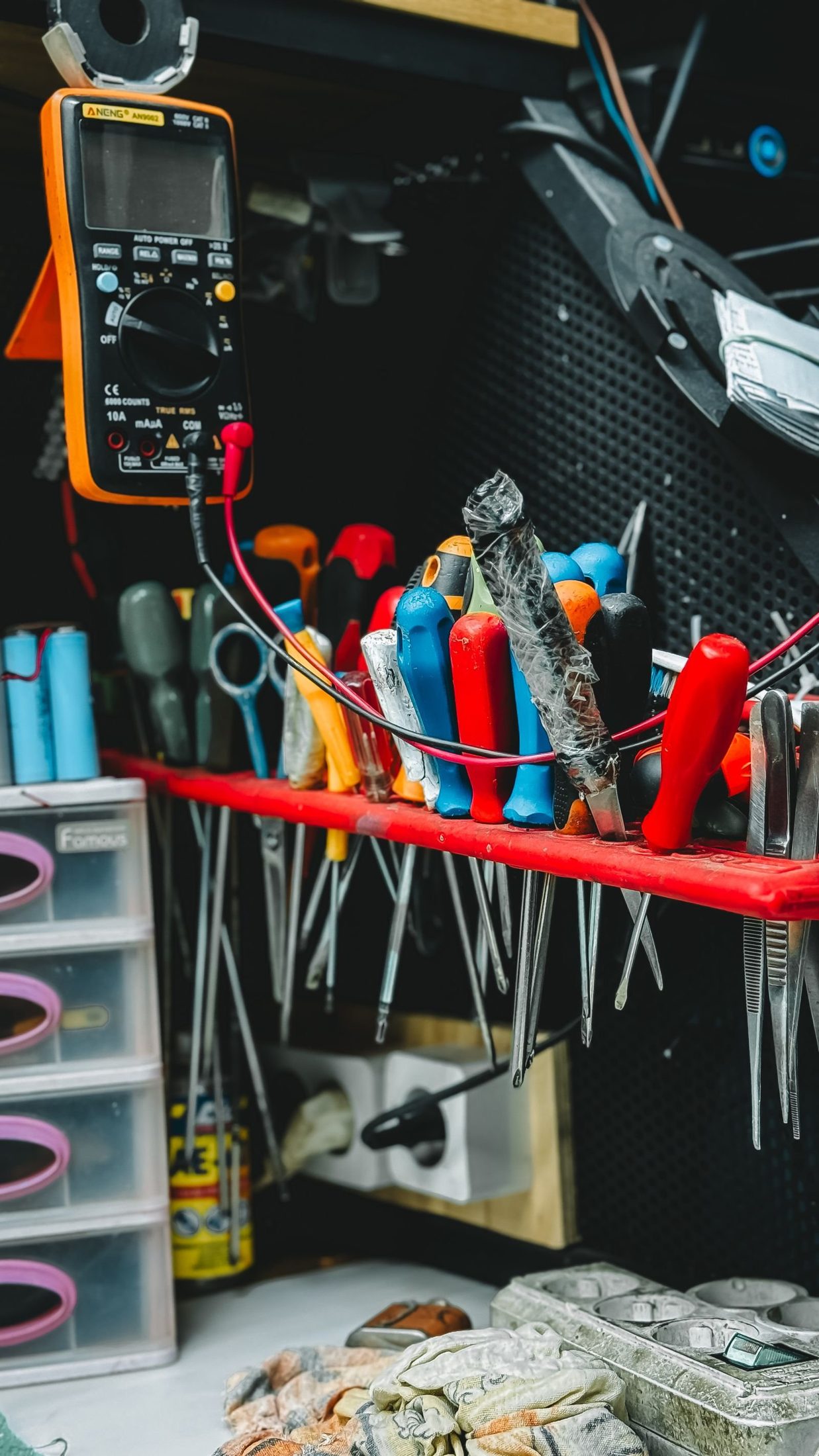 Workbench wall of hand tools and testers